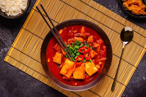 Korean traditional food, spicy kimchi soup (kimchi tige) with pork and tofu cheese.